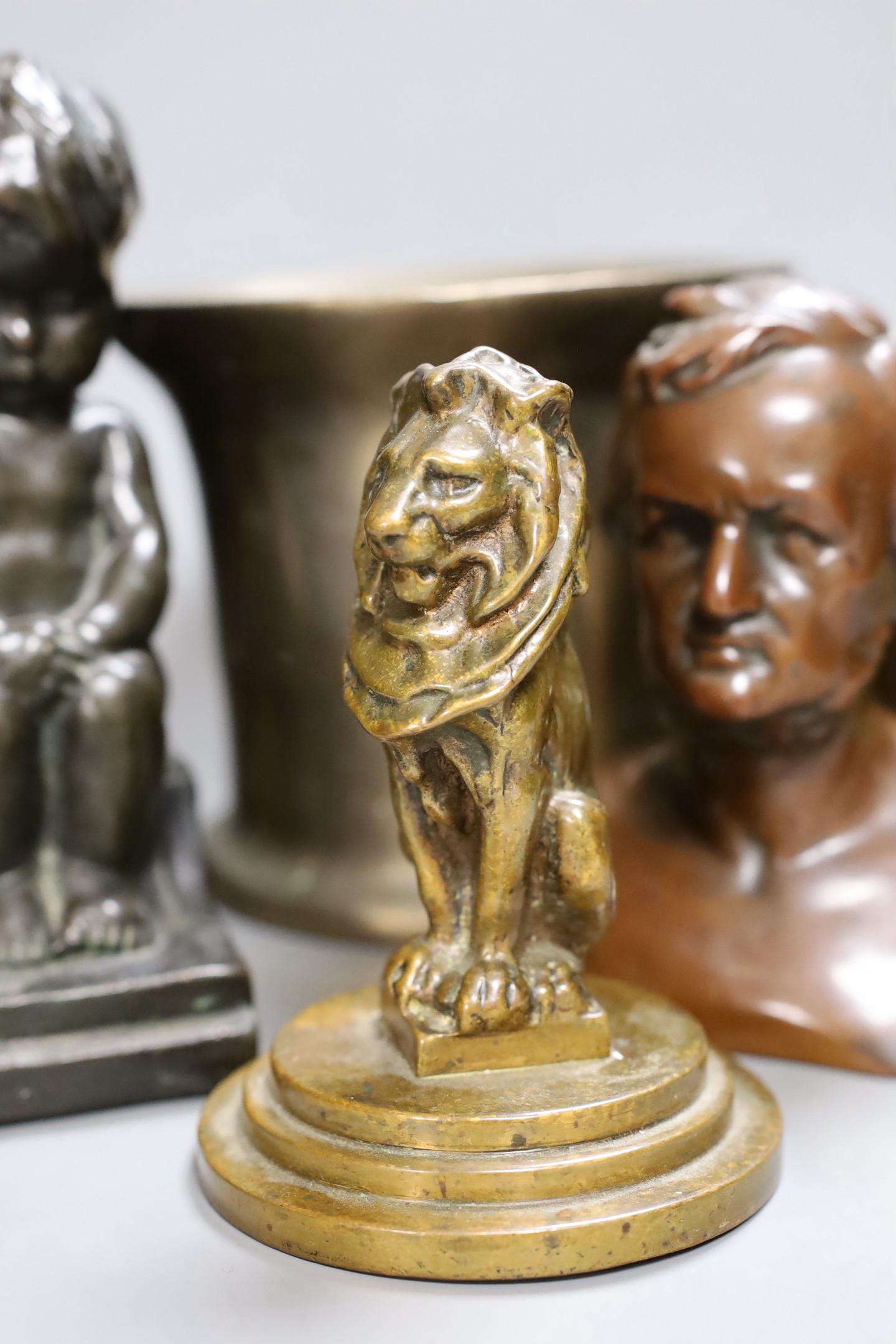 A weighted brass lion paperweight , bronzed bust, mortar, shell cased etc (6) tallest 14.5cm